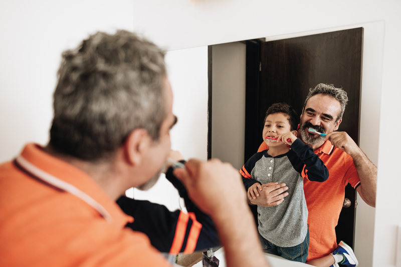 Father-and-son-brushing-teeth-800x533.jpg