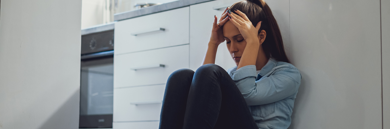 woman-sitting-on-floor-1242x411.jpg