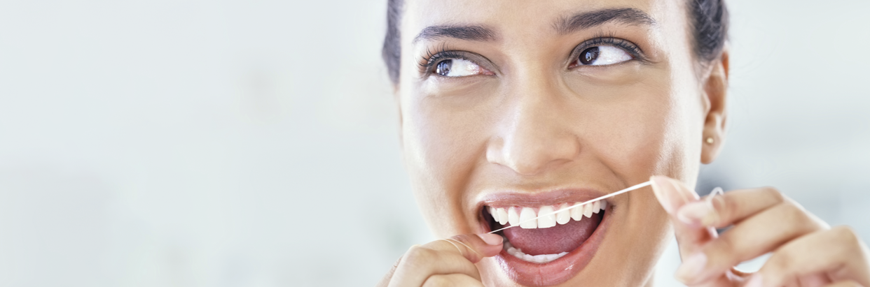 woman-flossing-1242x411.png