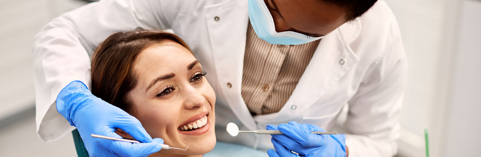 woman-and-dentist-1600x522.jpg