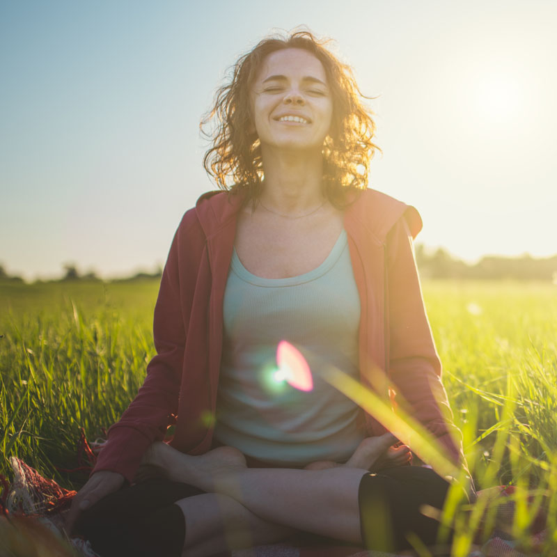 woman-sitting-in-grass-800x800.jpg