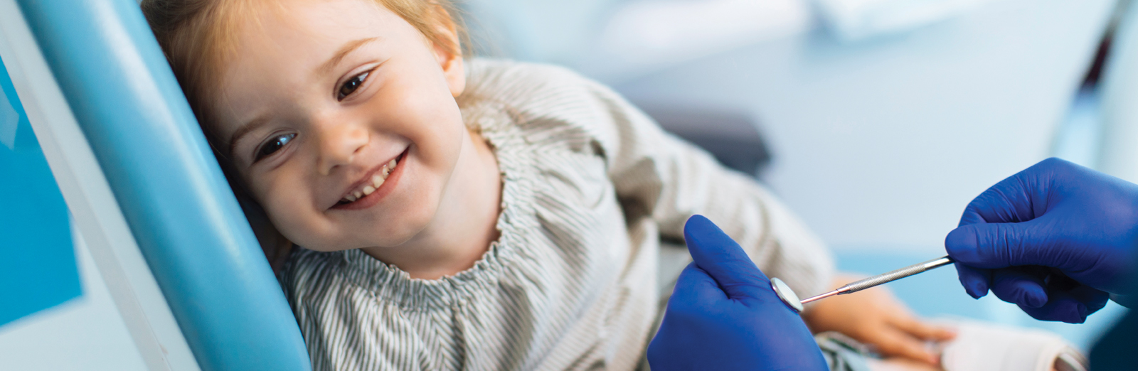 young-girl-in-dental-chair-1600x522.jpg