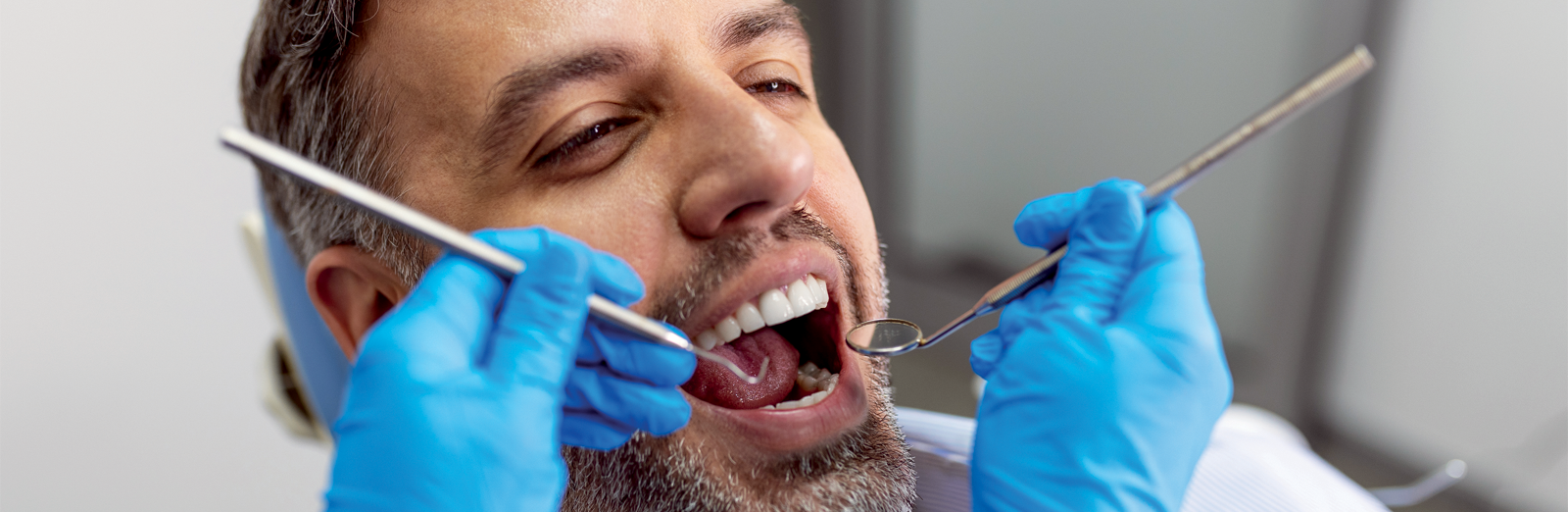 man-at-the-dentist-1600x522.png