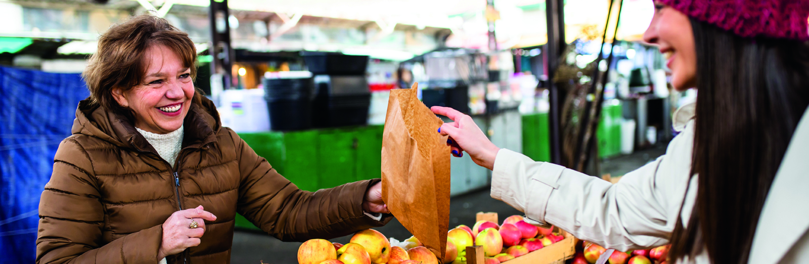 woman-shopping-at-farmers-market-1600x522.jpg