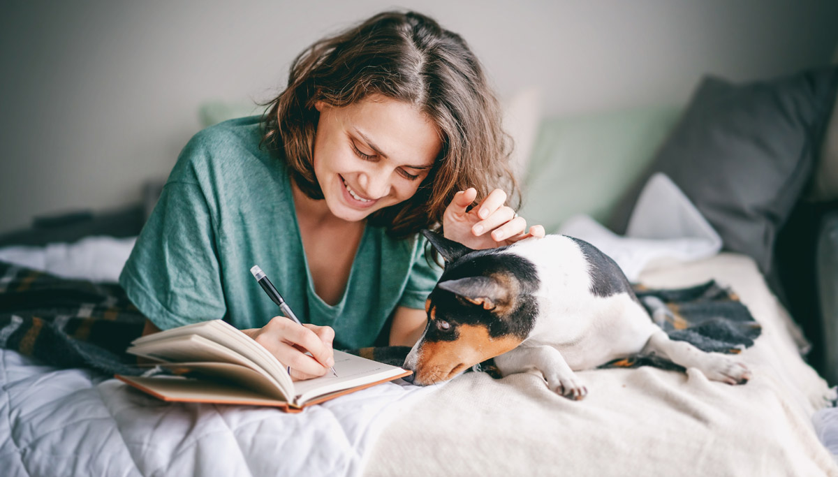 woman-writing-with-dog-1200x683.jpg