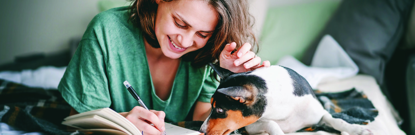 woman-writing-with-dog-1600x522.jpg