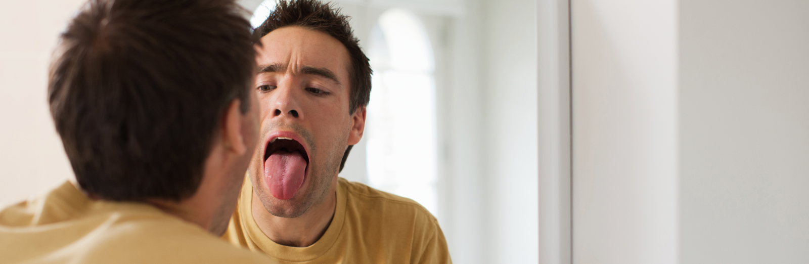 man-with-tongue-out-1600x522.png