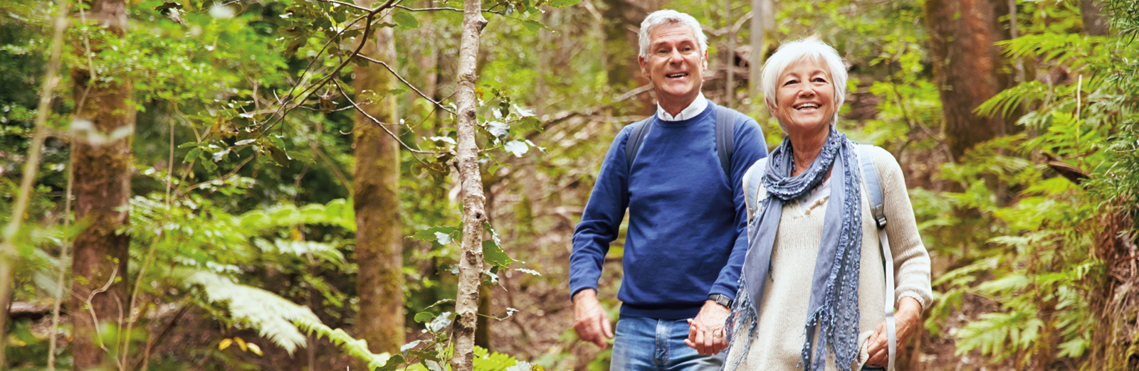 older-couple-holding-hands-1600x522.png