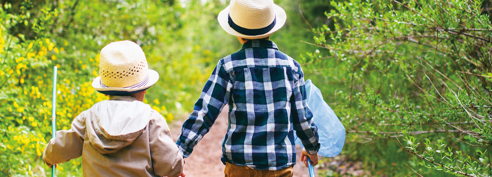 young-boys-holding-hands-1600x578.png