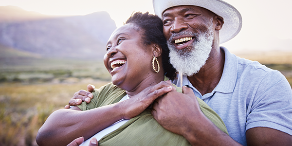 couple-smiling-outside-600x300.png