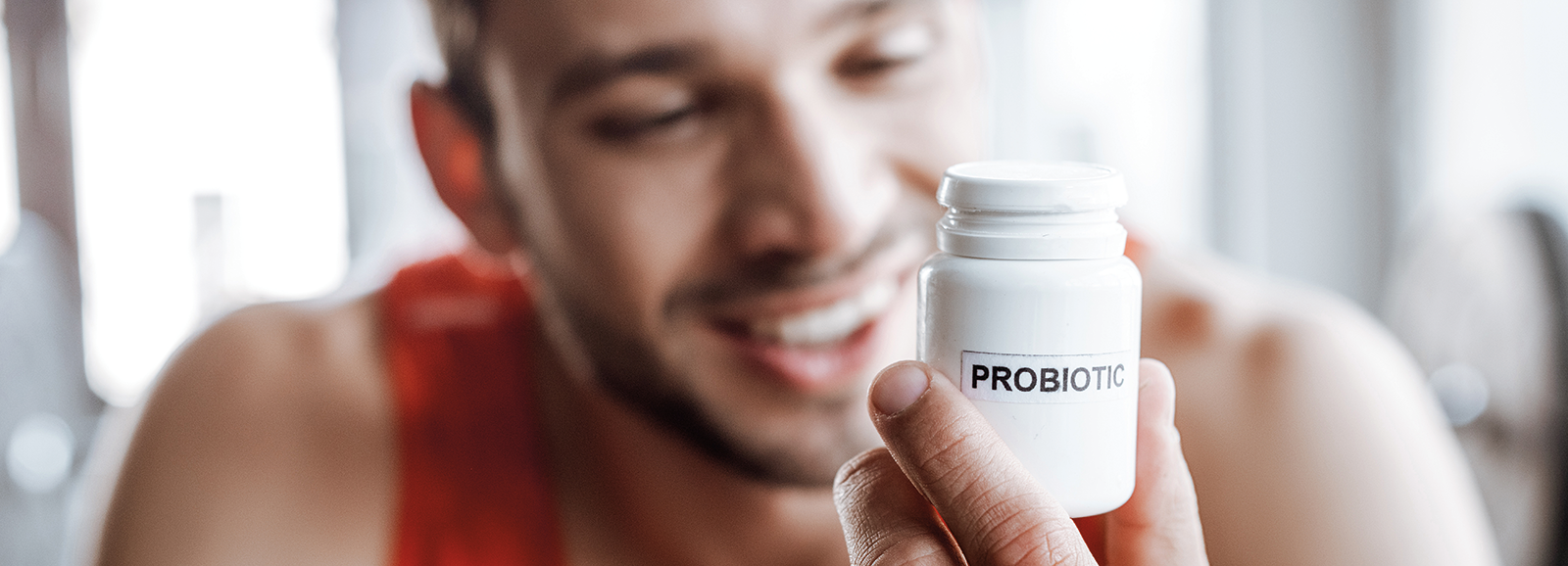 man-looking-at-probiotics-1600x578.png