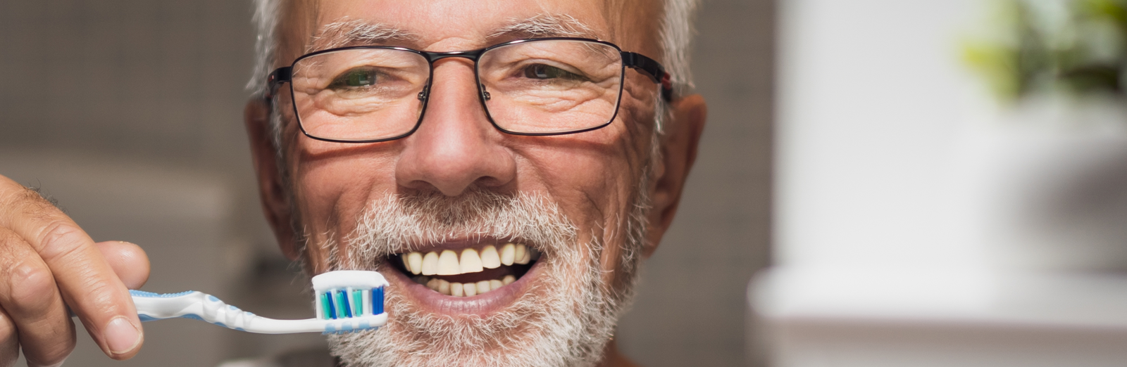 older-man-brushing-teeth-1600x522-ALT.png