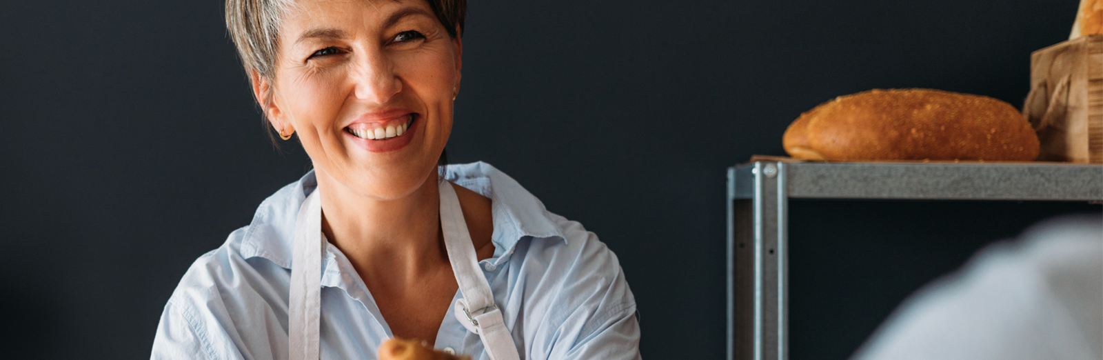 woman-selling-bread-1600x522.png