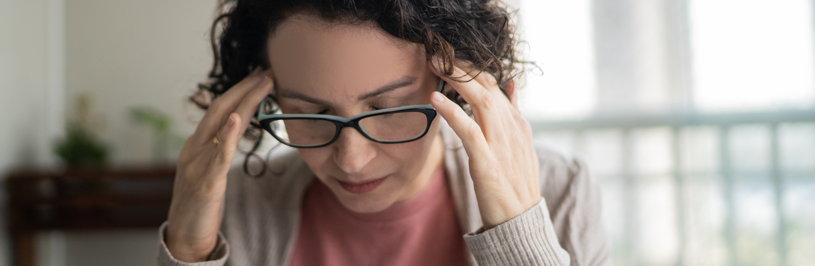 woman-with-glasses-thinking-1600x522-ALT.png