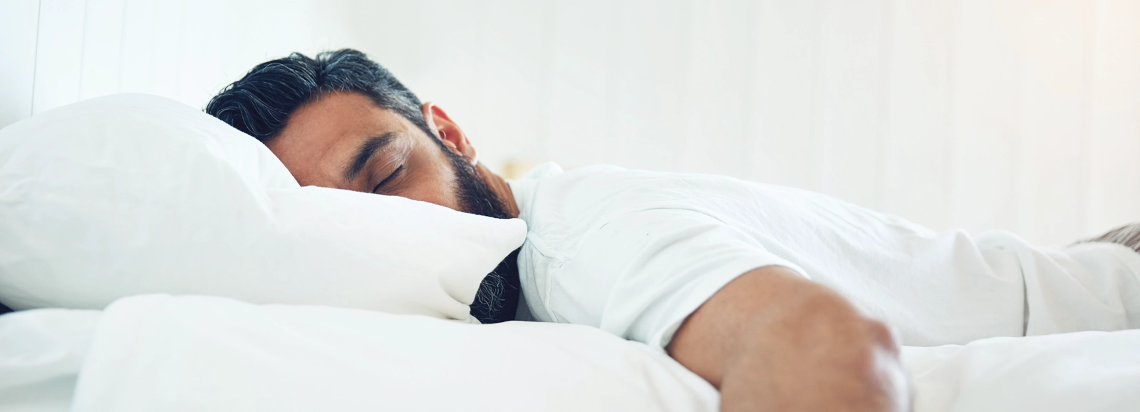 man-sleeping-1600x578.webp