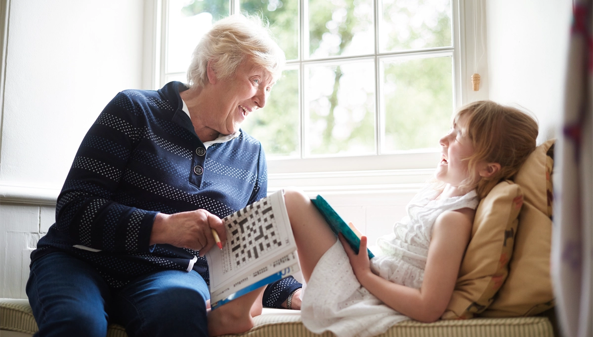 older-person-laughing-with-young-girl-1200x6831.webp