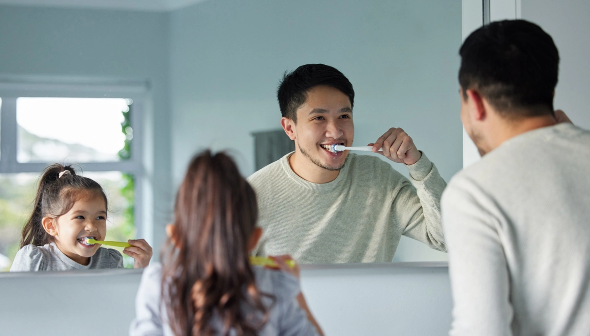 father-and-daughter-brushing-teeth-1200x683.webp