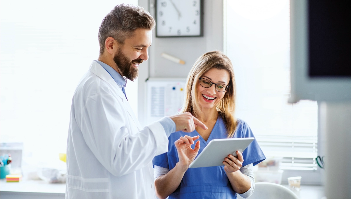 dentist-and-hygienist-looking-at-tablet-1200x683.webp