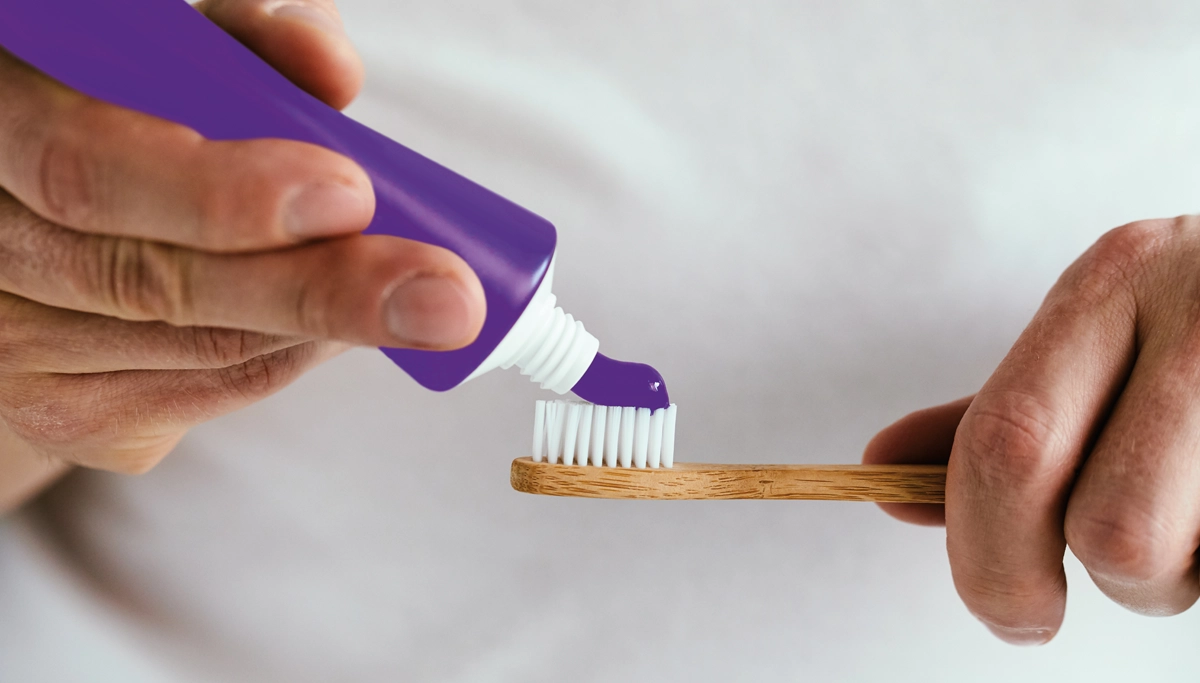 purple-toothpaste-on-a-toothbrush-1200x683.webp