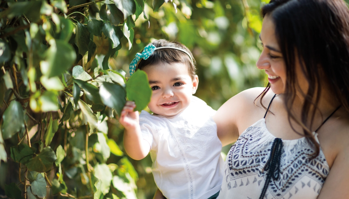 woman-and-baby-smiling-outside-1200x683.webp