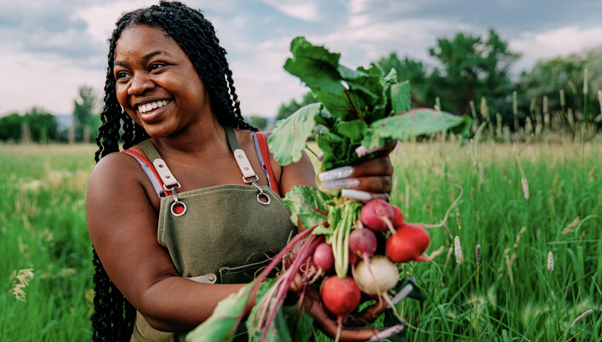 woman-smiling-holding-beets-1200x683.webp