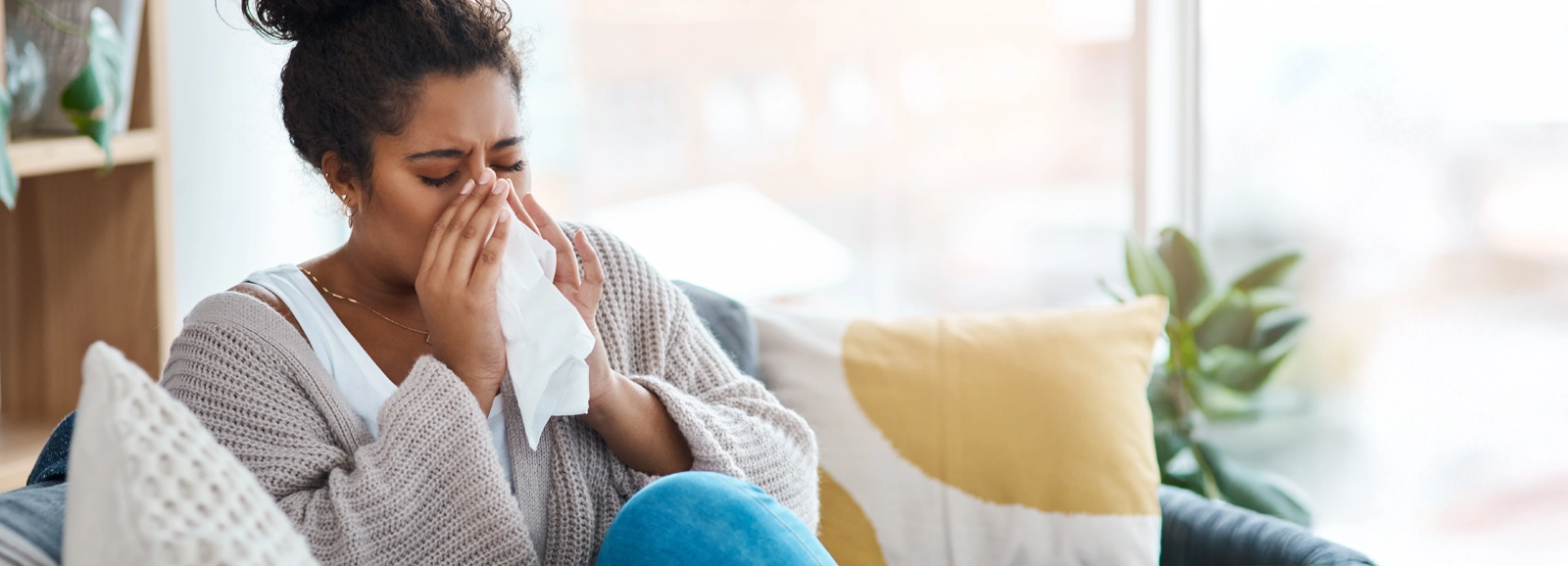 woman-using-a-tissue-1600x578.webp
