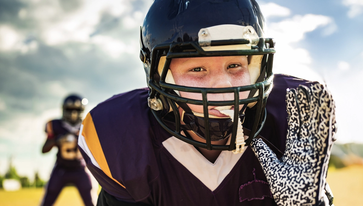 young-boy-playing-football-1200x683.webp