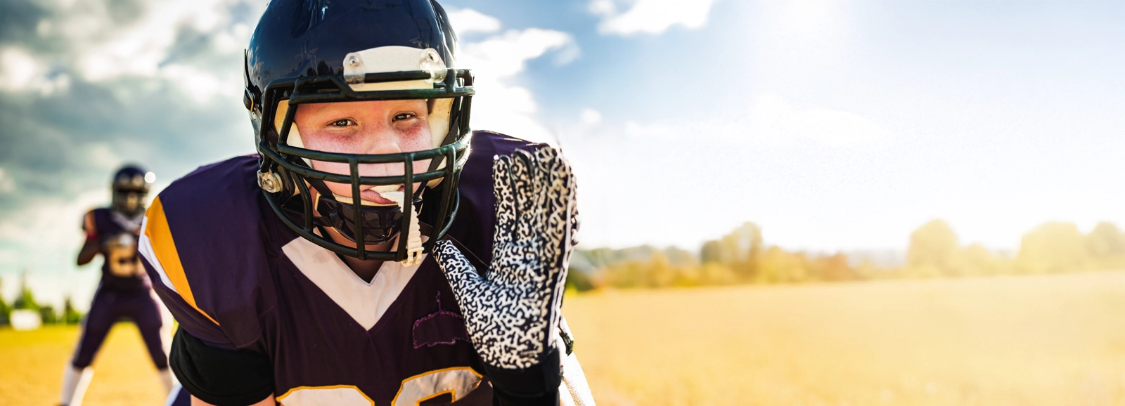 young-boy-playing-football-1600x578.webp