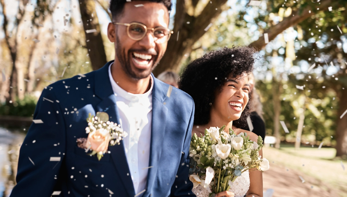 bride-and-groom-smiling-outside-1200x683.webp