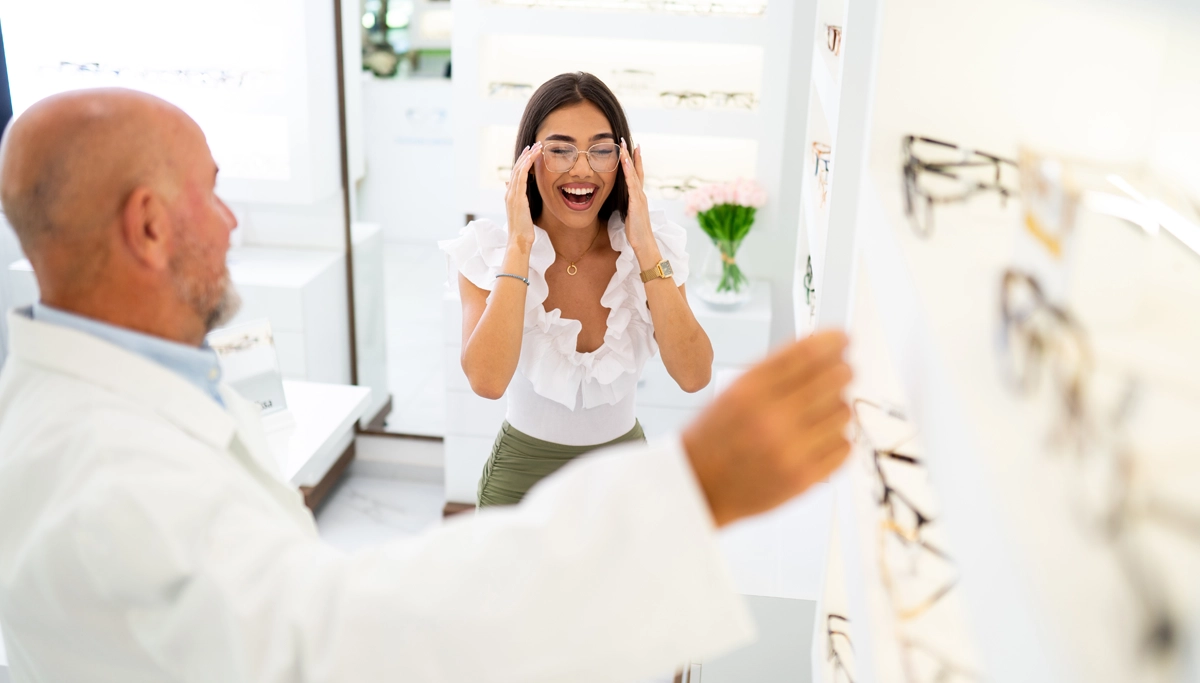 woman-smiling-in-glasses-at-optometrist-1200x683.webp