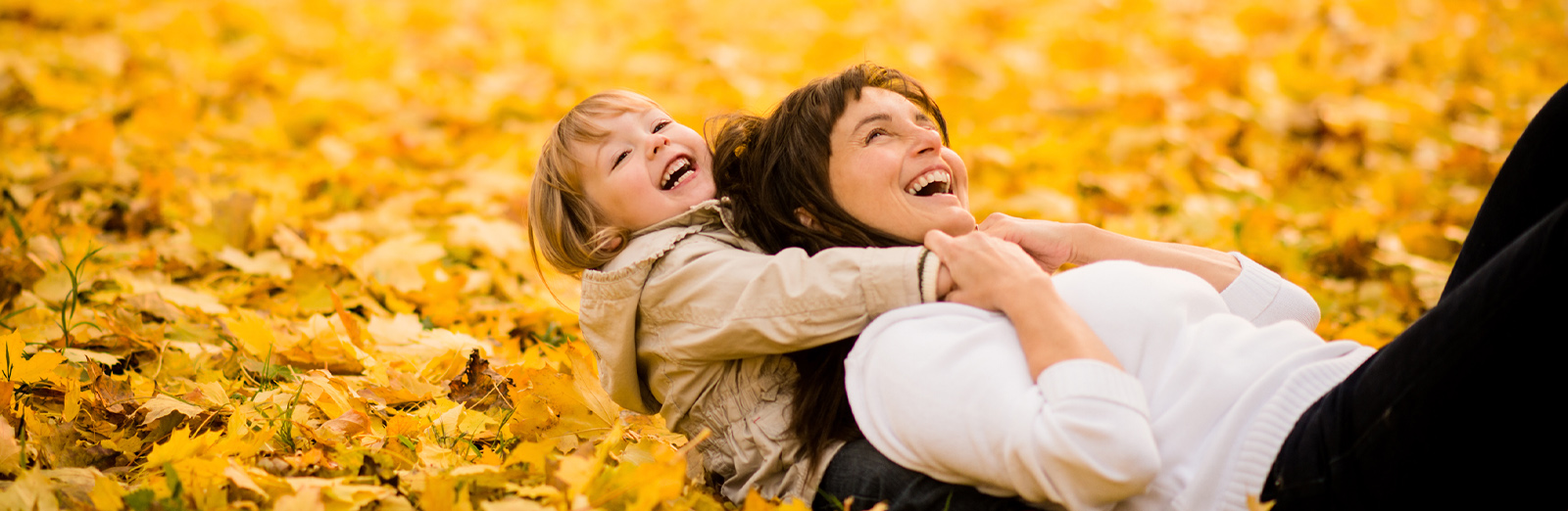mother-and-daughter-in-leaves-1600x522.jpg